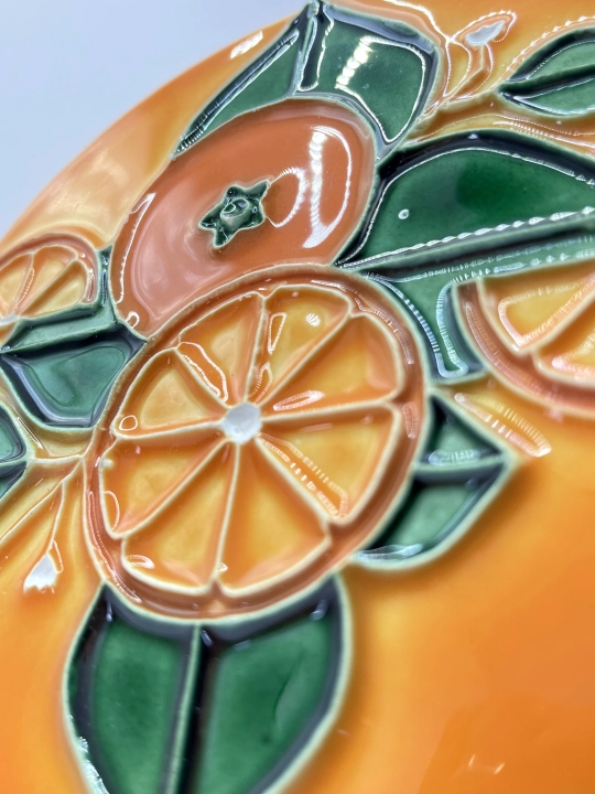 Ręcznie robiona podstawka ceramiczna z motywem pomarańczy
