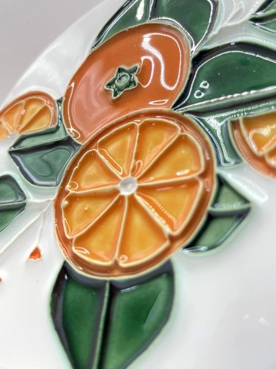 Ręcznie robiona podstawka ceramiczna z motywem pomarańczy