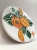 Ręcznie robiona podstawka ceramiczna z motywem pomarańczy