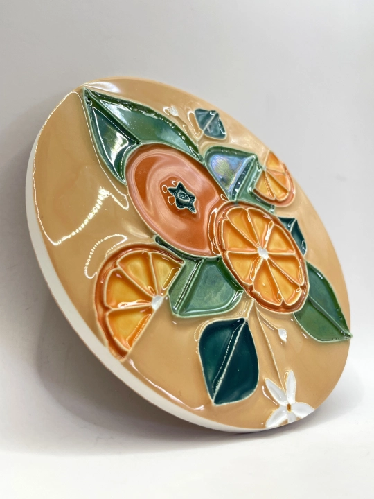 Ręcznie robiona podstawka ceramiczna z motywem pomarańczy